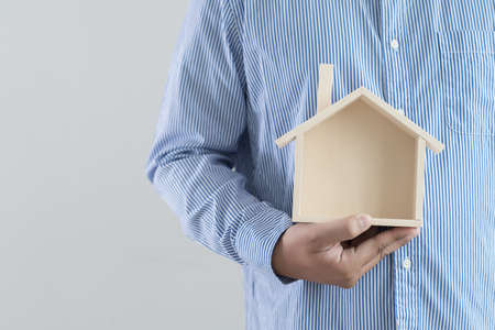 hands holding house homeless housing shelter  architecture  building  construction, real estate and propertyの写真素材