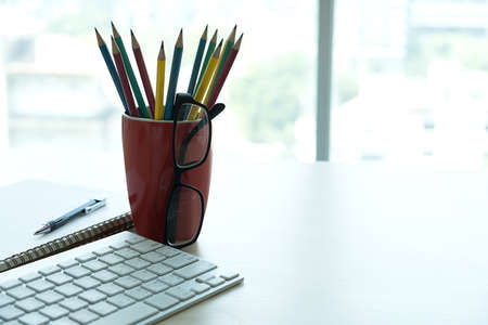 Close up of glasses and computer  business workplace work place in officeの写真素材