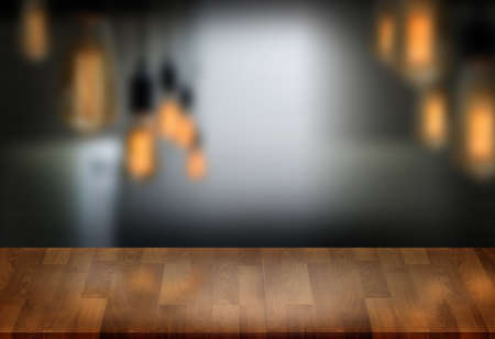 Wooden board empty table  cafe, coffee shop, bar blurred background can be used for display or montage your products and Mock upの写真素材