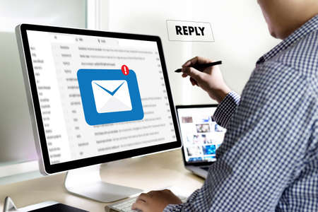 reply the message email on computer Businessman is working to important reminderの写真素材