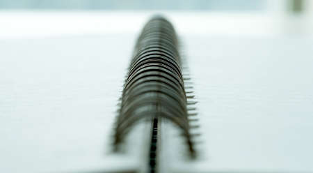 Extreme closeup of a spiral notebook closeup notepad as mockup for your design.の写真素材