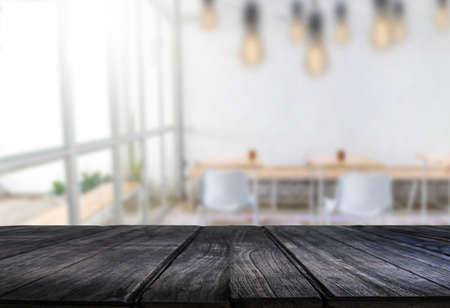 Wooden board empty table  window blurred background can be used for display or montage your products and Mock upの写真素材