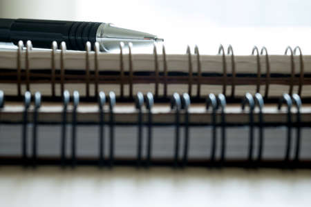 Extreme closeup of a spiral notebook closeup notepad as mockup for your design.の写真素材