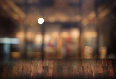 Wooden board empty table  cafe, coffee shop, bar blurred background can be used for display or...