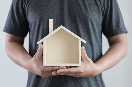hands holding house 
homeless housing shelter  architecture  building  construction, real estate and propertyの写真素材