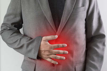 man stomach suffering and having a stomachacheの写真素材