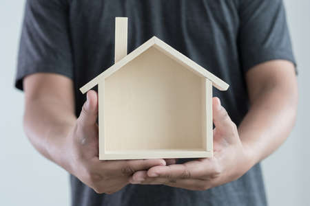 hands holding house homeless housing shelter  architecture  building  construction, real estate and propertyの写真素材