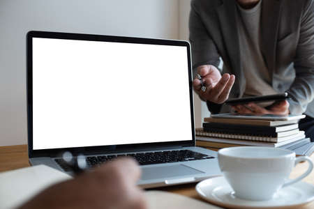 Laptop with blank screen on table. Workspace background new project on laptop computer with blank copy space screen for your advertising text messageの写真素材