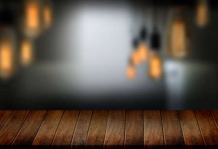 Wooden board empty table  cafe, coffee shop, bar blurred background can be used for display or...