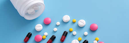 medicine  pills on blue background Copy space for text Assorted pharmaceutical Healthy Eating,...
