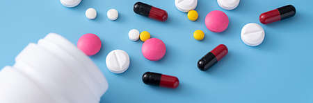 medicine  pills on blue background Copy space for text Assorted pharmaceutical Healthy Eating,...