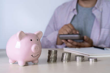 man Savings Coins wealth and financial Saving money business conceptの写真素材