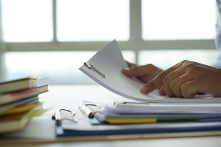 Businessman working reading documents graph financial to job succes Analyze document plans