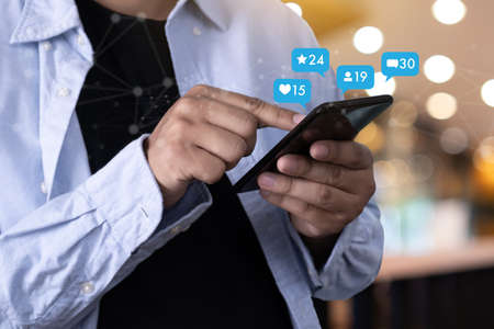 Young man using smart phone Social media and social network Marketing  concept People Connection
