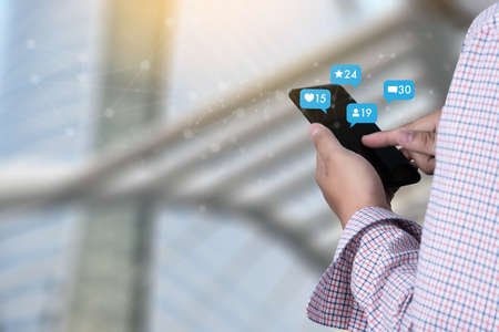 Young man using smart phone Social media and social network Marketing  concept People Connection