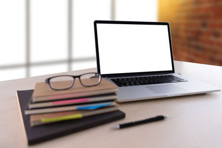 Laptop with blank screen on table. Workspace background new project on laptop computer with blank copy space screen for your advertising text messageの写真素材