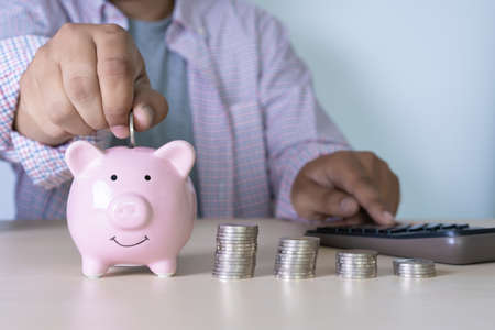 man Savings Coins wealth and financial Saving money business conceptの写真素材