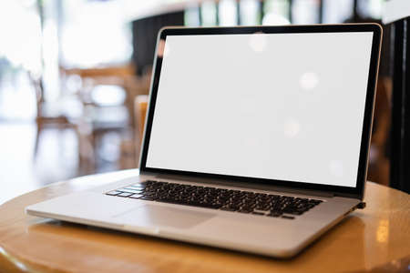 Laptop with blank screen on table. Workspace background new project on laptop computer with blank copy space screen for your advertising text messageの写真素材