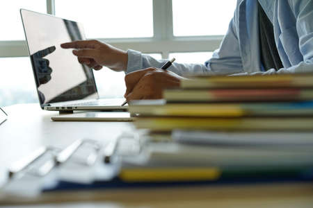 Businessman working reading documents graph financial to job succes Analyze document plans
