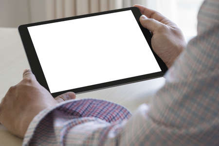 Digital tablet computer close up man using tablet hands man multitasking with isolated screen