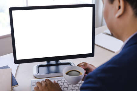 man of business man hand working on laptop computer blank white screen laptop  on vintage woodenの写真素材