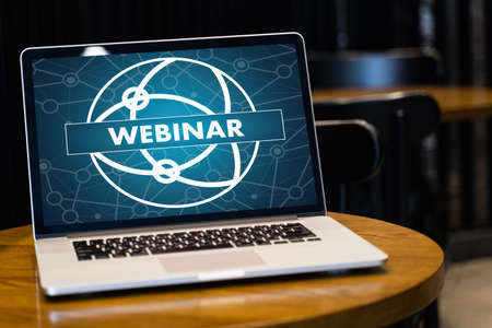 WEBINAR hand on table use E-business Browsing Connection in computer, coffee, Split toneの写真素材