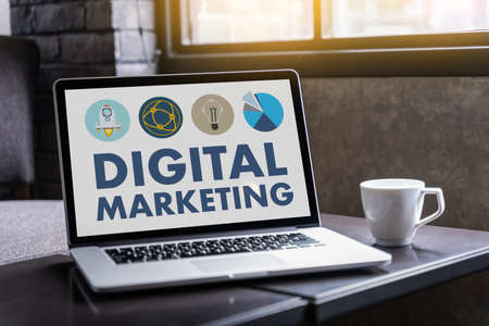 DIGITAL MARKETING new startup project MILLENNIALS Business team hands at work with financial reports and a laptopの写真素材