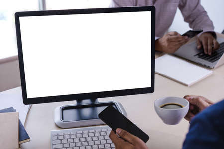 man of business man hand working on laptop computer blank white screen laptop  on vintage woodenの写真素材