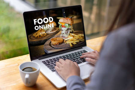 Close up woman ordering food online  by internet  Concept order food
