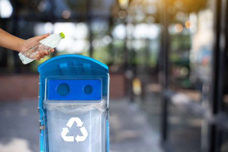 man hand putting plastic reuse for recycling concept environmental protection world recycle