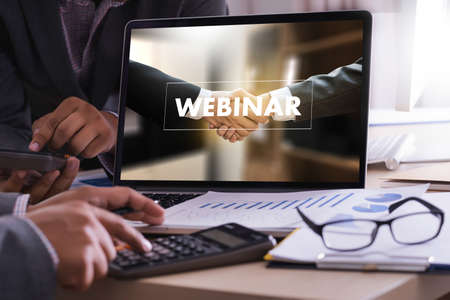 WEBINAR hand on table use E-business Browsing Connection in computer, coffee, Split tone