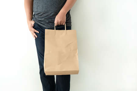 Consumer pack product Man shows bag mock up showの写真素材