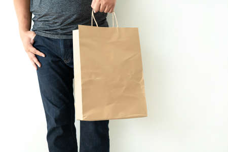 Consumer pack product Man shows bag mock up showの写真素材