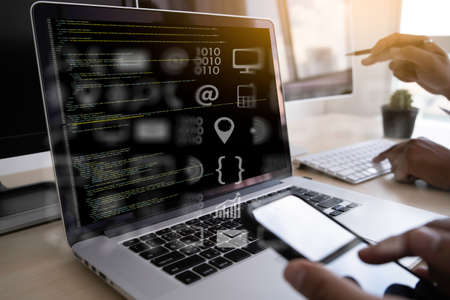 man work Coding software developer programmer is coding on a desktop computerの写真素材