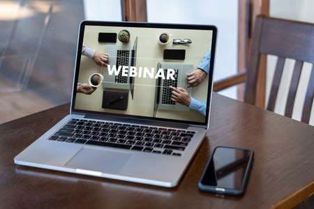 WEBINAR hand on table use E-business Browsing Connection in computer, coffeeの写真素材