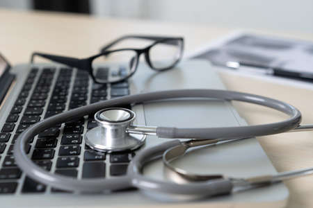Health care writing prescription Doctor working with laptop computerの写真素材