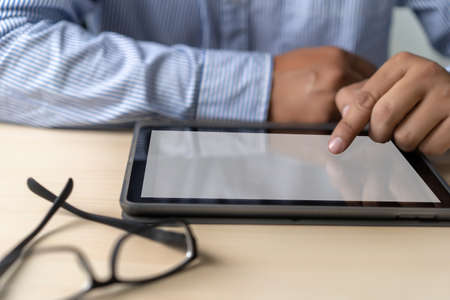 Mockup of business man using  laptop screen for your advertising text messageの写真素材