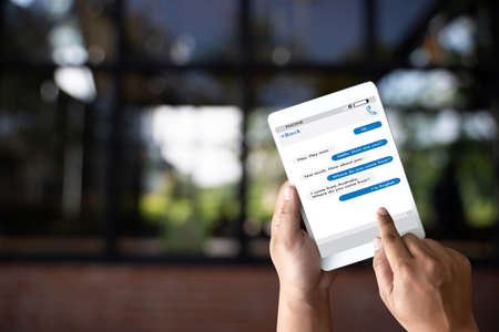man touch on button instant messaging app on mobile phone