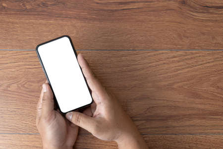 Man hand holding the black smartphone screen mockup