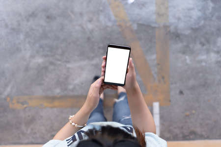 Woman using tablet Mockup for your own content  at home blank empty screen