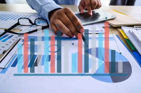 Working team meeting concep graph financial with social network diagram discussing data analysis...