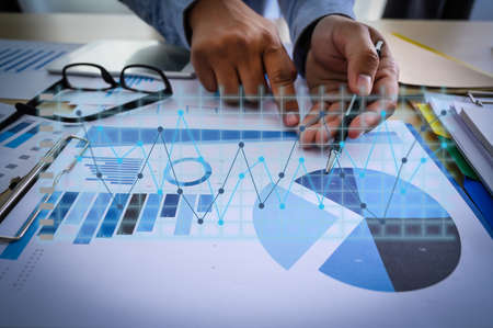 Working team meeting concep graph financial with social network diagram discussing data analysis...
