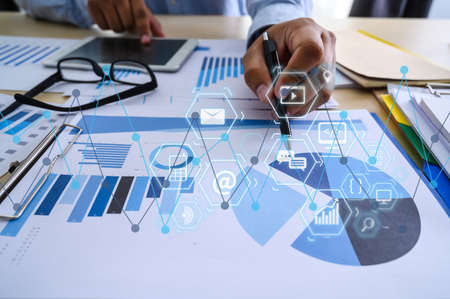 Working team meeting concep graph financial with social network diagram discussing data analysis...