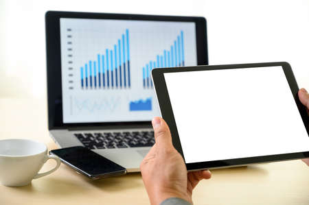 man  hands multitasking man using tablet close up close up working in office