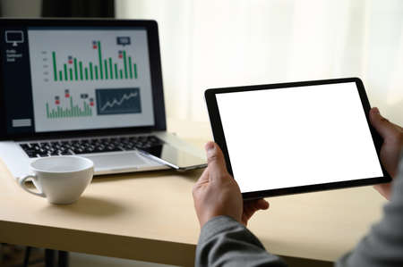 man  hands multitasking man using tablet close up close up working in office
