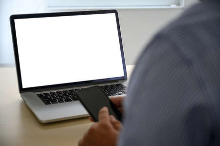 man working on his laptop with blank copy space Laptop with blank screen Mock up Blank screen...