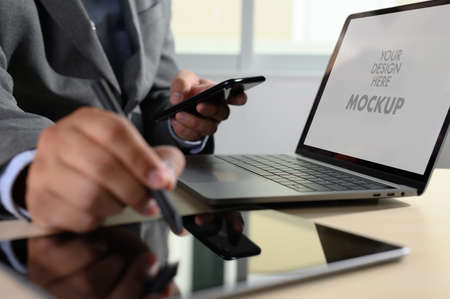 Laptop with blank screen on table. Workspace background new project on laptop computer with blank copy space screen for your advertising text messageの写真素材