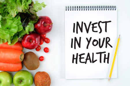 Invest in your health , Healthy lifestyle concept with diet and fitness , Get fit in  , fitness equipment and healthy foodの写真素材