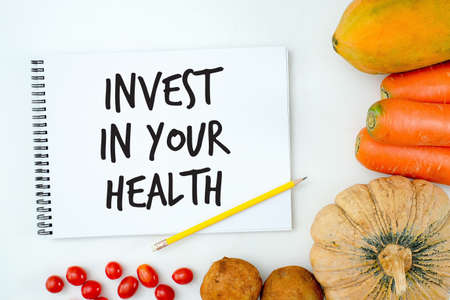 Invest in your health , Healthy lifestyle concept with diet and fitness , Get fit in  , fitness equipment and healthy foodの写真素材