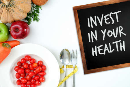 Invest in your health , Healthy lifestyle concept with diet and fitness , Get fit in  , fitness equipment and healthy foodの写真素材